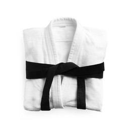 Martial arts uniform with black belt on white background, top view