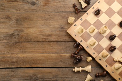 Flat lay composition of chess on wooden table, space for text. Board game