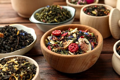 Many different herbal teas on wooden table
