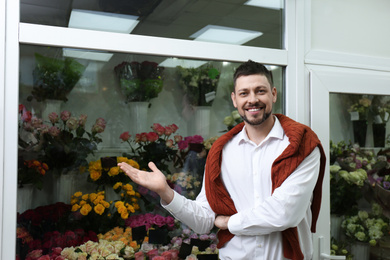 Male business owner standing in his flower shop