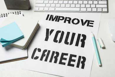Composition with phrase IMPROVE YOUR CAREER on white table