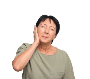 Photo of Senior woman suffering from ear pain on white background