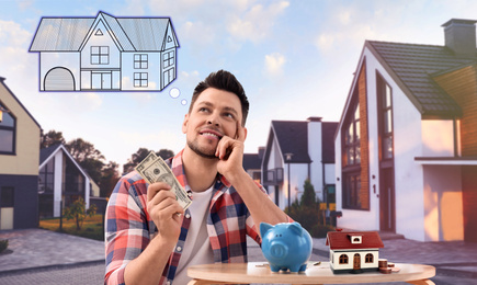 Man with money and piggy bank daydreaming about house