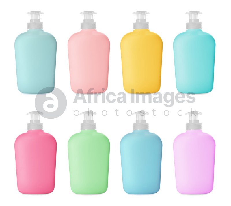Set with multicolored bottles of liquid soap on white background
