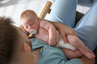 Father with his newborn son, above view