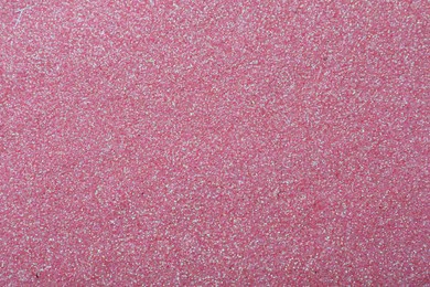 Beautiful shiny pink glitter as background, closeup