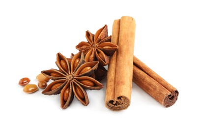 Dry anise stars and cinnamon sticks on white background