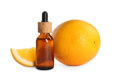 Bottle of citrus essential oil and fresh oranges on white background