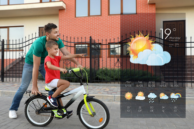 Happy father teaching his son to ride bicycle and weather forecast widget. Mobile application
