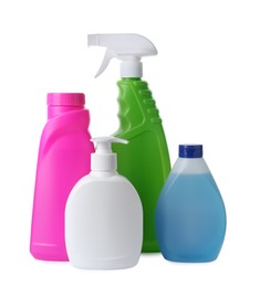 Photo of Bottles with different detergents on white background. Cleaning supplies
