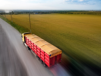 Logistics concept. Truck on country road, motion blur effect 