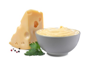 Photo of Tasty cheese, sauce, parsley and peppercorns on white background