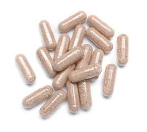 Many transparent gelatin capsules on white background, top view