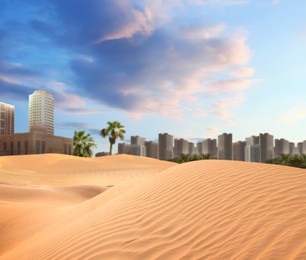 Sandy desert and beautiful view of city on horizon 