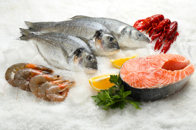 Photo of Fresh fish and different seafood on ice