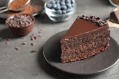 Delicious fresh chocolate cake served on grey table