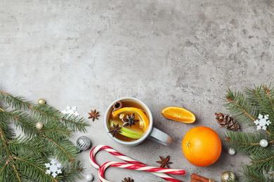Aromatic white mulled wine on light grey table, flat lay. Space for text