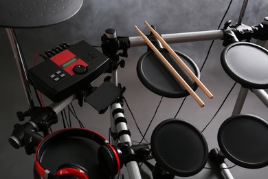 Modern electronic drum kit and smoke on grey background. Musical instrument