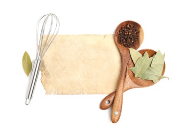 Old cookbook page, spices and kitchen utensils on white background, top view. Space for text