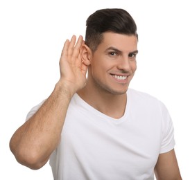 Man showing hand to ear gesture on white background