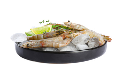 Photo of Plate with raw shrimps, lime slices, thyme and ice isolated on white