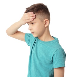 Little boy suffering from headache on white background