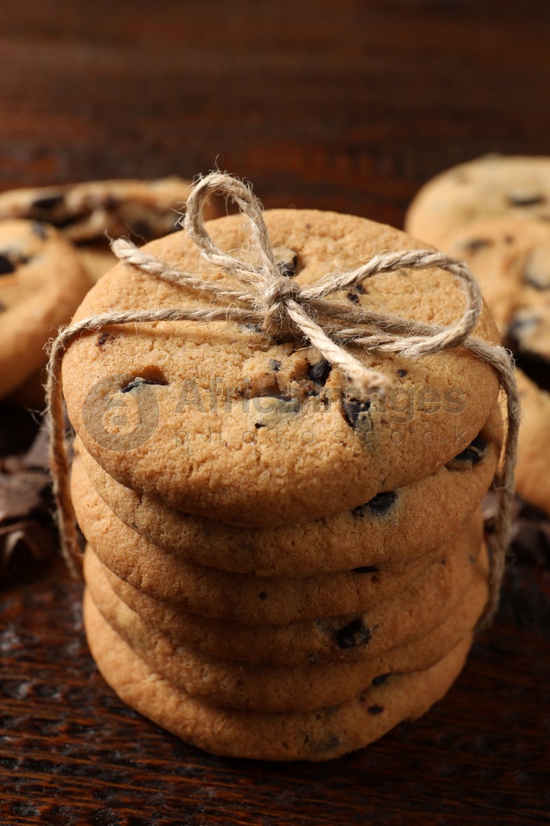 Delicious chocolate chip cookies on wooden table