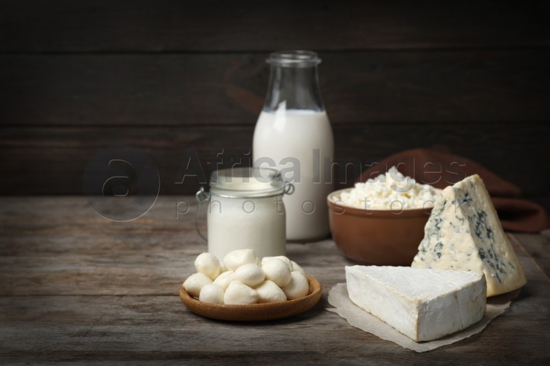 Different fresh dairy products on wooden table