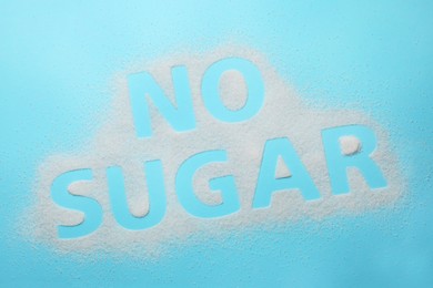 Words No Sugar on light blue background, top view