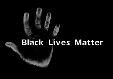 Black Lives Matter. Hand print on dark background