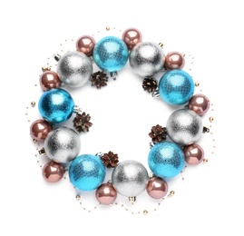 Beautiful Christmas wreath made of shiny baubles, garland and pine cones on white background, top view