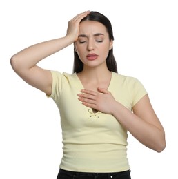 Young woman suffering from headache on white background. Cold symptoms