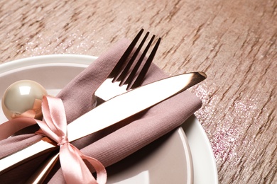 Beautiful Christmas table setting on brown background, closeup