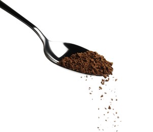 Pouring aromatic instant coffee from spoon on white background