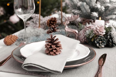 Photo of Luxury place setting with beautiful festive decor for Christmas dinner on table, closeup