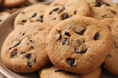 Delicious chocolate chip cookies on plate, closeup