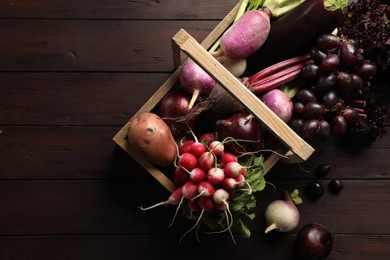 Photo of Different fresh ripe vegetables on wooden table, flat lay. Space for text