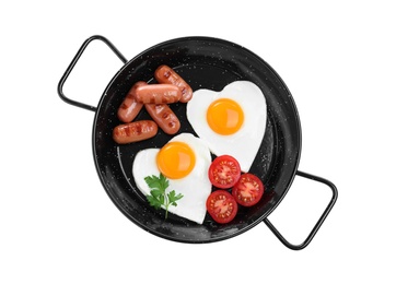 Romantic breakfast with fried sausages and heart shaped eggs isolated on white, top view. Valentine's day celebration