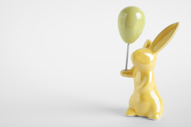 Easter bunny figure on white background. Space for text