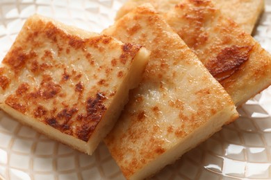 Delicious turnip cake on plate, closeup view
