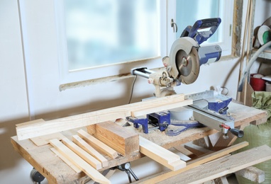Modern circular saw in carpentry shop. Working space