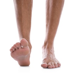 Man standing on white background, closeup of feet