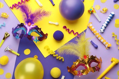 Flat lay composition with carnival items on color background