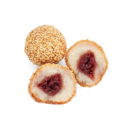 Photo of Delicious sesame balls with red bean paste on white background, top view