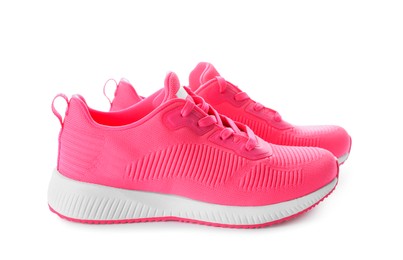 Pair of stylish pink sneakers on white background