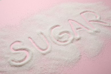 Photo of Composition with word SUGAR on pink background
