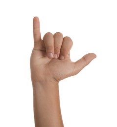 Teenage boy showing call me gesture on white background, closeup