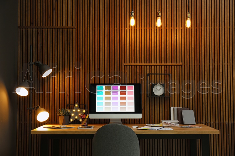 Photo of Modern designer's workplace with computer in office
