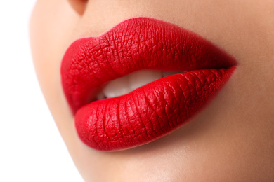 Woman with red lipstick on white background, closeup
