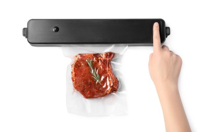 Woman using sealer for vacuum packing and plastic bag with meat steak, rosemary on white background